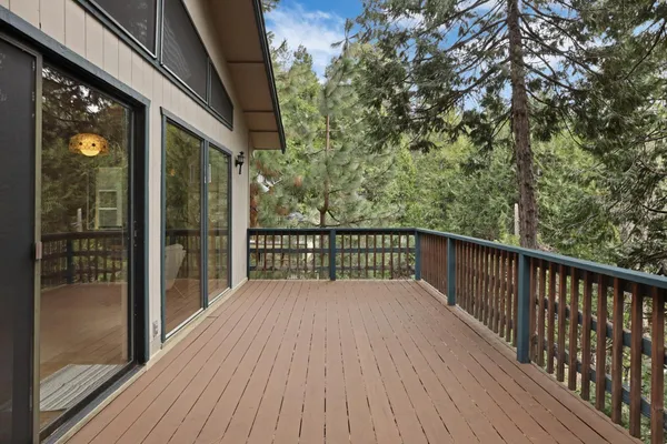 a view of a balcony with wooden floor