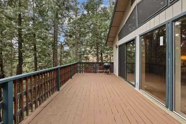 a view of balcony with wooden floor