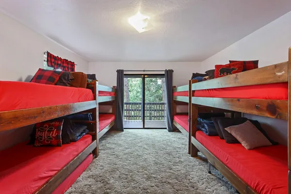 a bed room with a bed and a chair