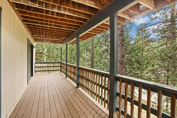 a view of balcony with wooden floor