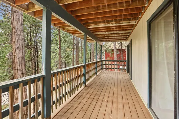 a view of balcony with wooden floor