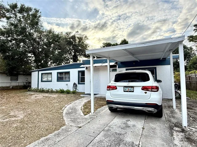 a view of a car in front of a house