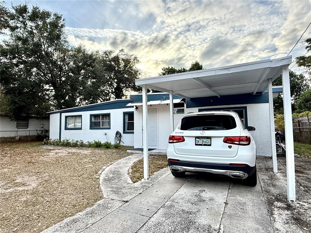 902 San Domingo Road Orlando, FL 32808 - Photo 2 of 18 a view of a car in front of a house