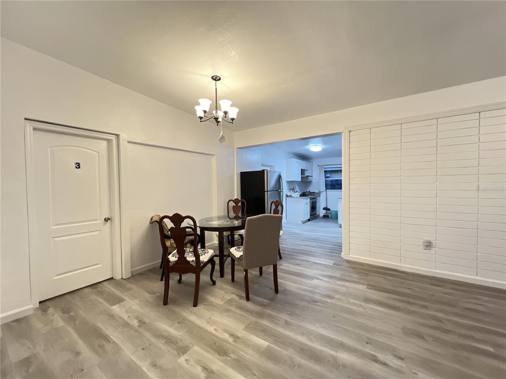 902 San Domingo Road Orlando, FL 32808 - Photo 6 of 18 a view of a dining room with furniture and chandelier