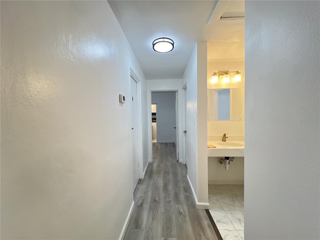 902 San Domingo Road Orlando, FL 32808 - Photo 7 of 18 a view of a bathroom with a sink and a mirror