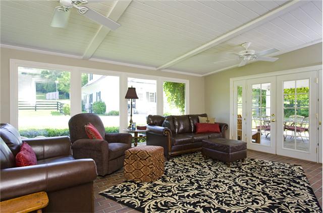 1488 Coleman Road Franklin, TN 37064 - Photo 5 of 20 This den, with its many windows can easily substitute for a sun room. From here you can view the covered porch, patio and pool. You can even see horses in the back pasture!