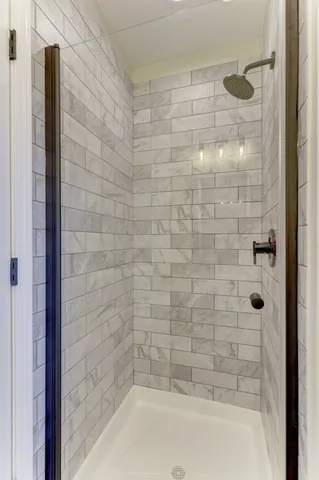 a bathroom with a shower and a bathtub