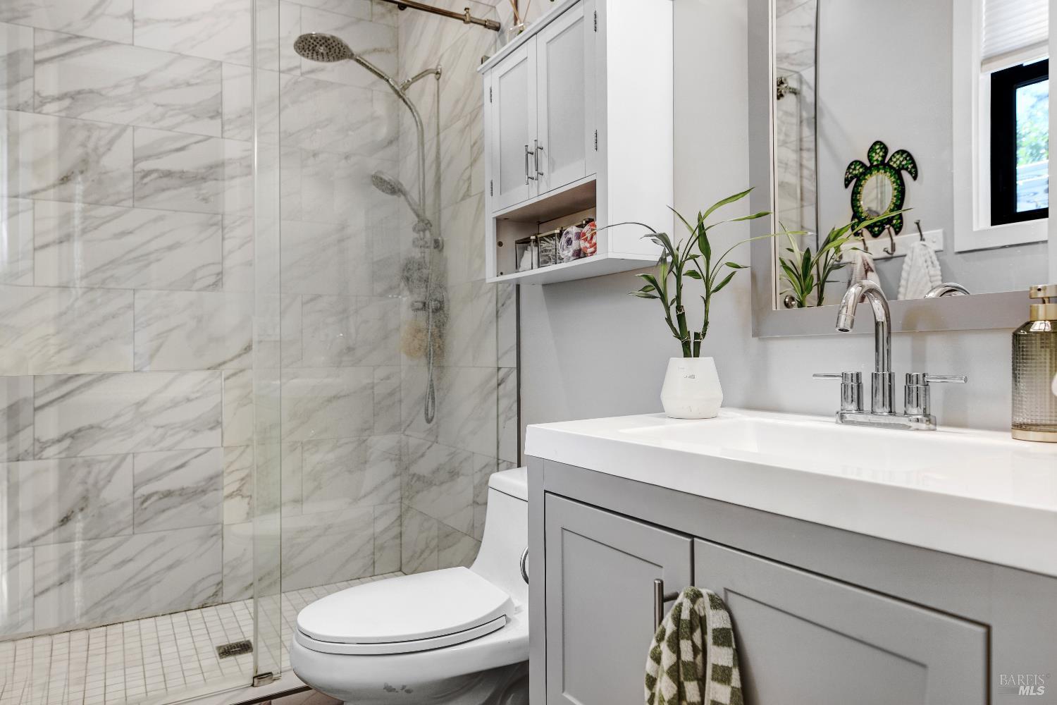 85 Trinity Road Glen Ellen, CA 95442 - Photo 47 of 62 a bathroom with a sink a toilet and mirror