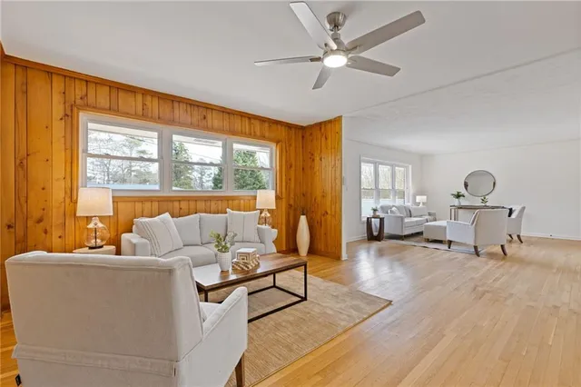 a kitchen with granite countertop white cabinets white appliances and sink