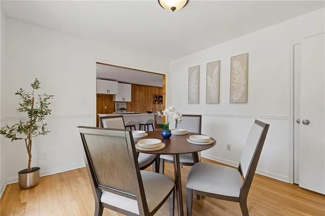 a view of a livingroom with furniture and chandelier