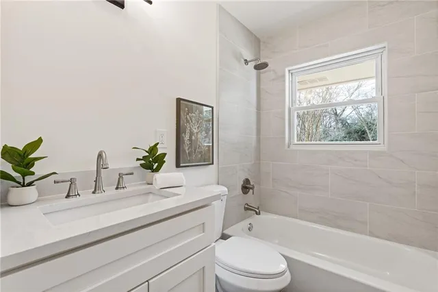 a view of an empty room with windows