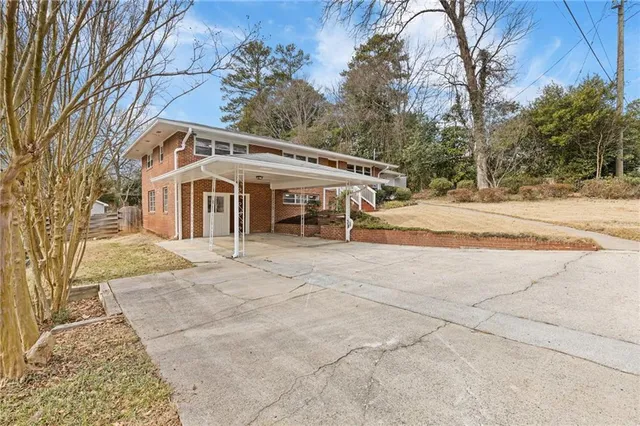 front view of a house with a trees