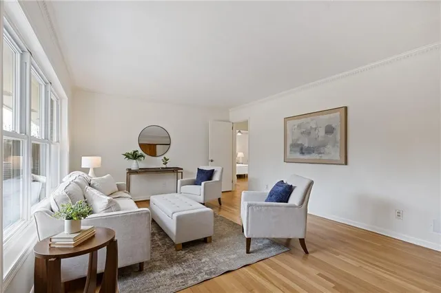 a kitchen with white cabinets and appliances