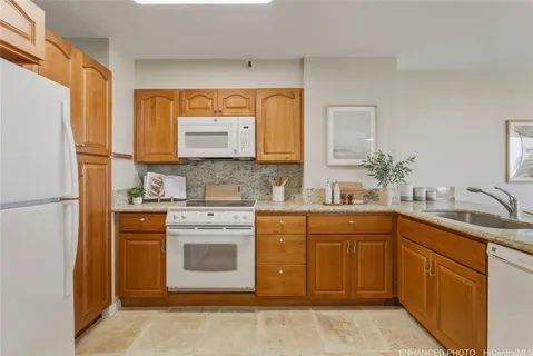 a kitchen with a sink stove and refrigerator