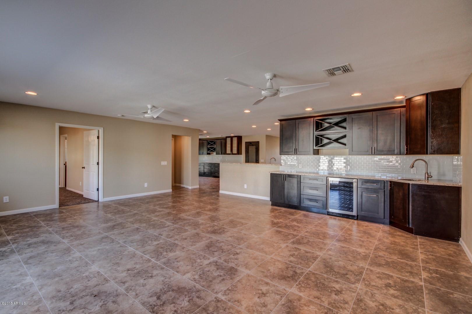 3028 East Charter Oak Road Phoenix, AZ 85032 - Photo 12 of 30 Cabinets and bar in family room