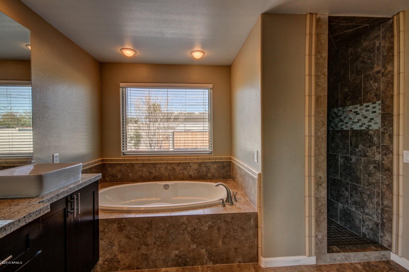 3028 East Charter Oak Road Phoenix, AZ 85032 - Photo 15 of 30 Master Bath tub and shower