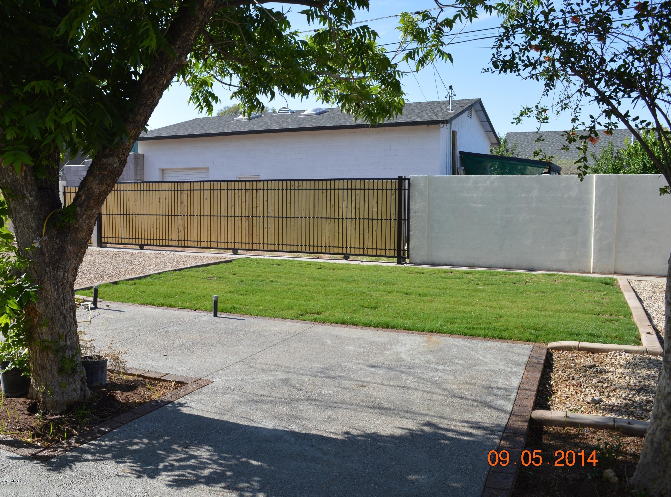 3028 East Charter Oak Road Phoenix, AZ 85032 - Photo 25 of 30 Back Patio and Grass