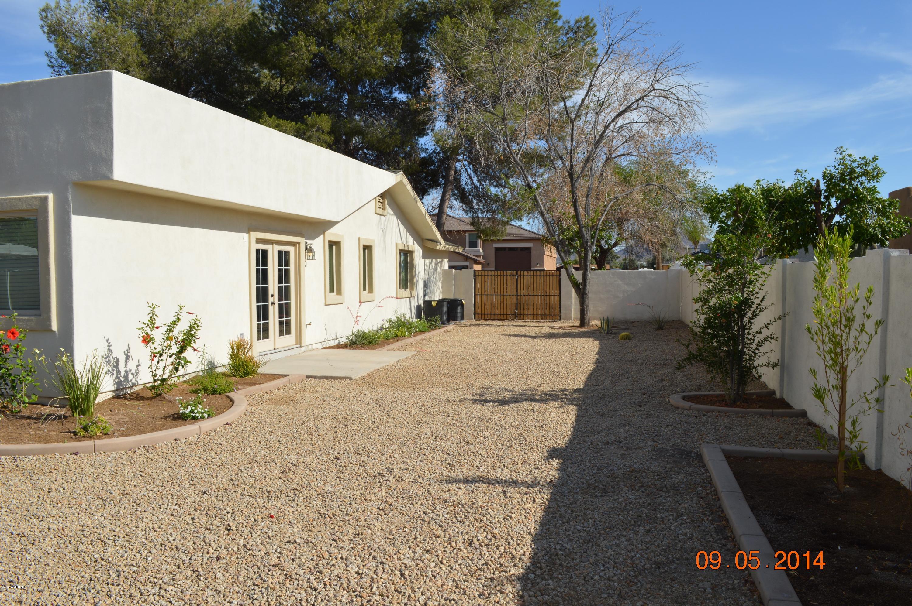 3028 East Charter Oak Road Phoenix, AZ 85032 - Photo 29 of 30 West Side Yard with RV Gate