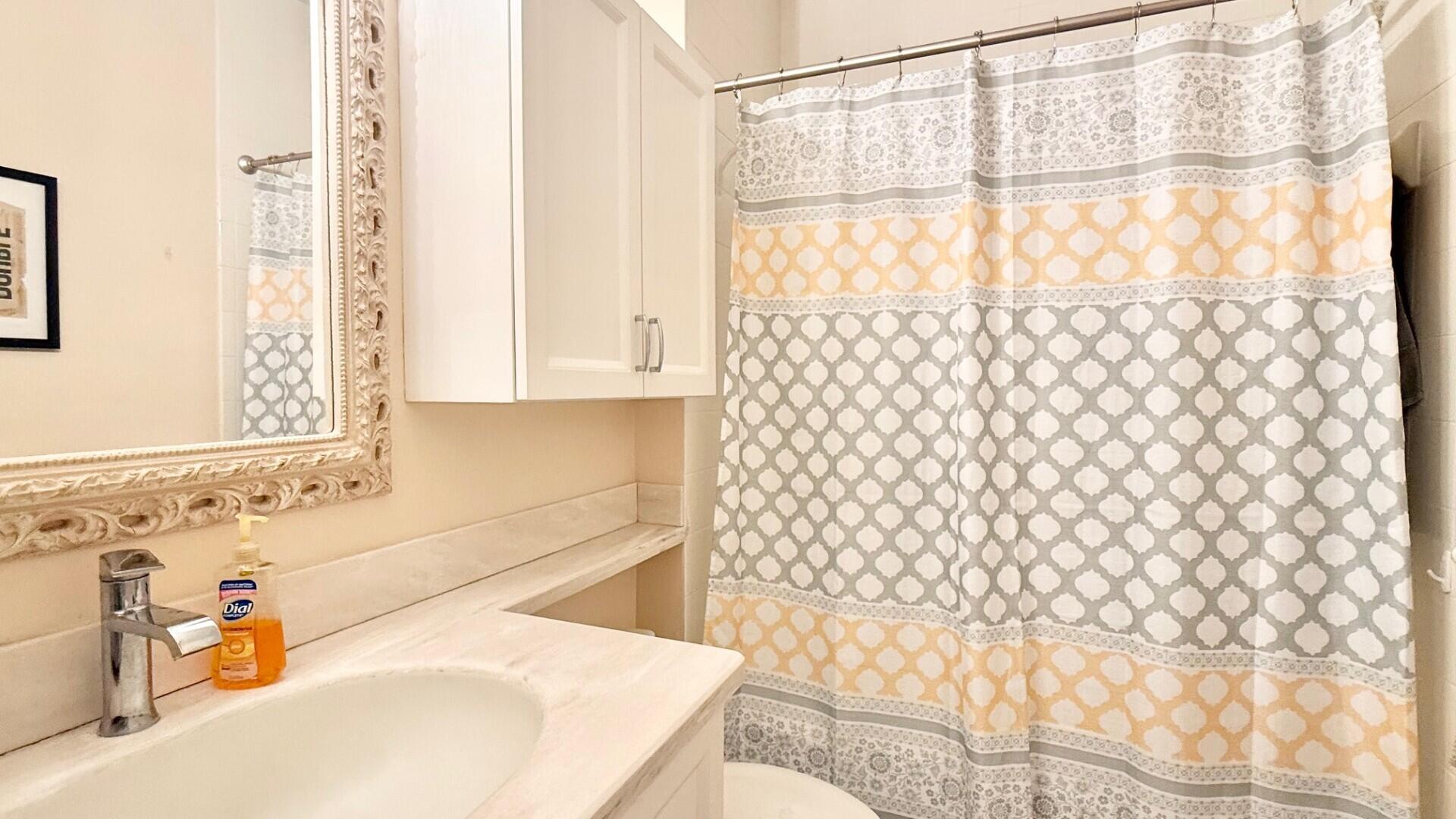 9905 Galleon Drive West Palm Beach, FL 33411 - Photo 14 of 16 a bathroom with a sink and a bathtub