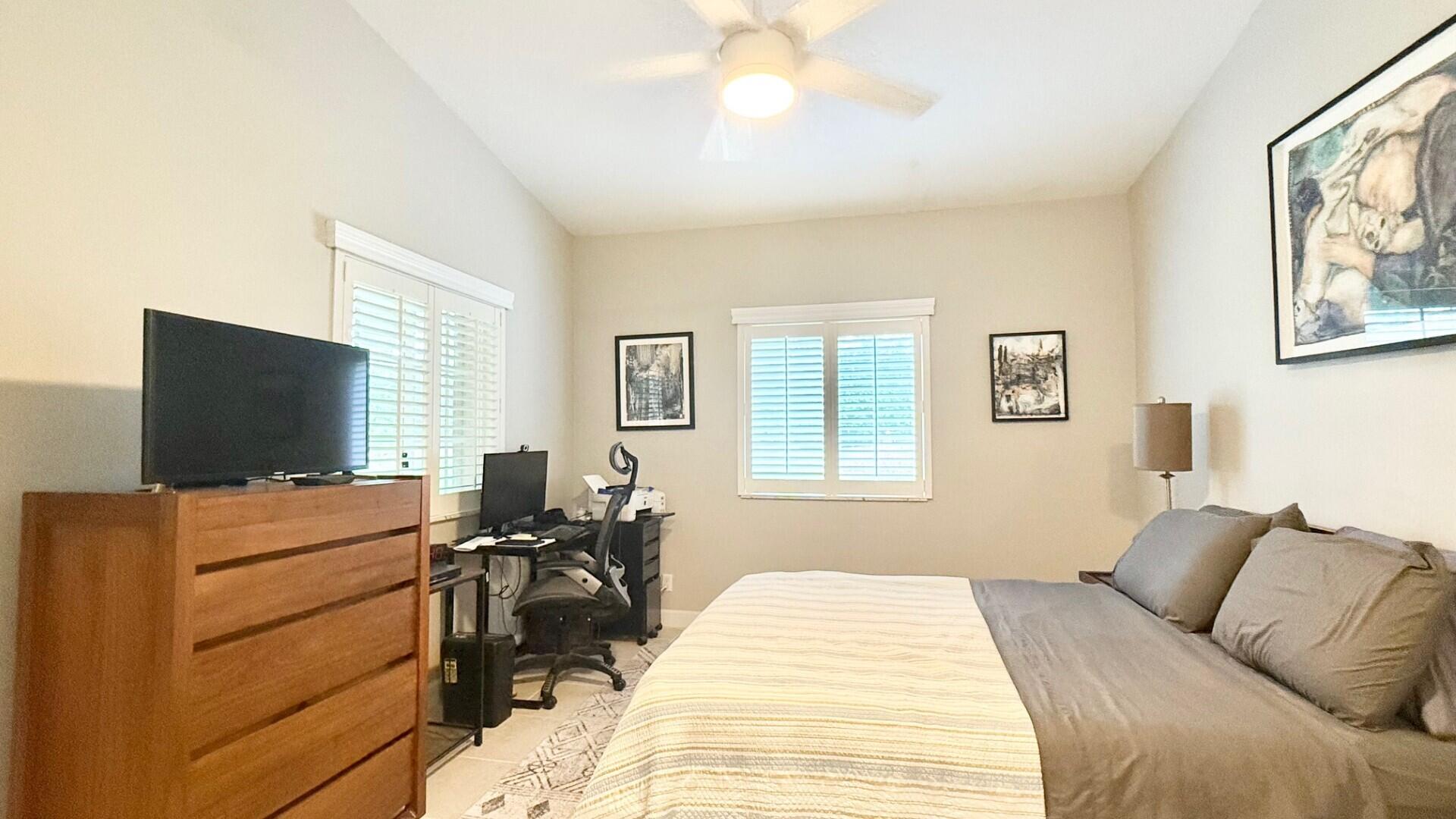 9905 Galleon Drive West Palm Beach, FL 33411 - Photo 10 of 16 a bedroom with a bed and furniture