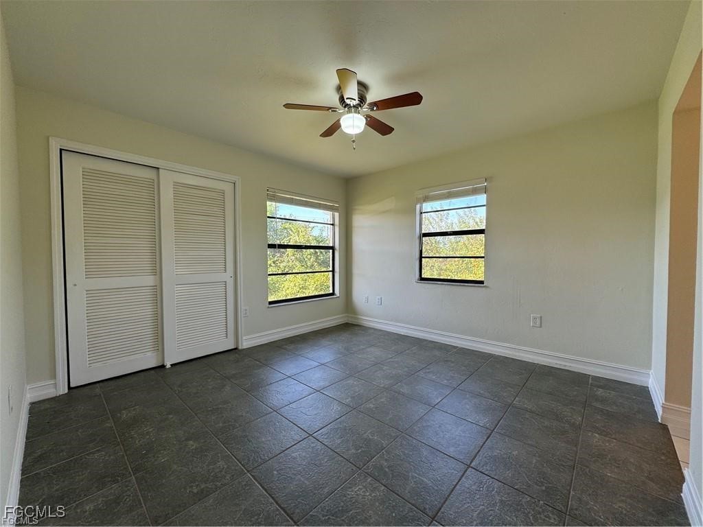 645 Homestead Road South Lehigh Acres, FL 33974 - Photo 8 of 17 a view of an empty room with a window