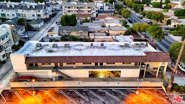 an aerial view of a house with swimming pool