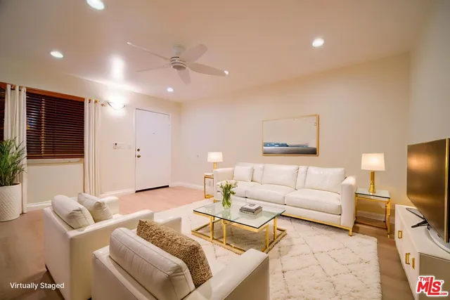 a view of a dining room with furniture wooden floor and chandelier