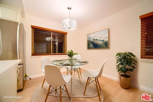 a kitchen with stainless steel appliances a refrigerator sink and microwave