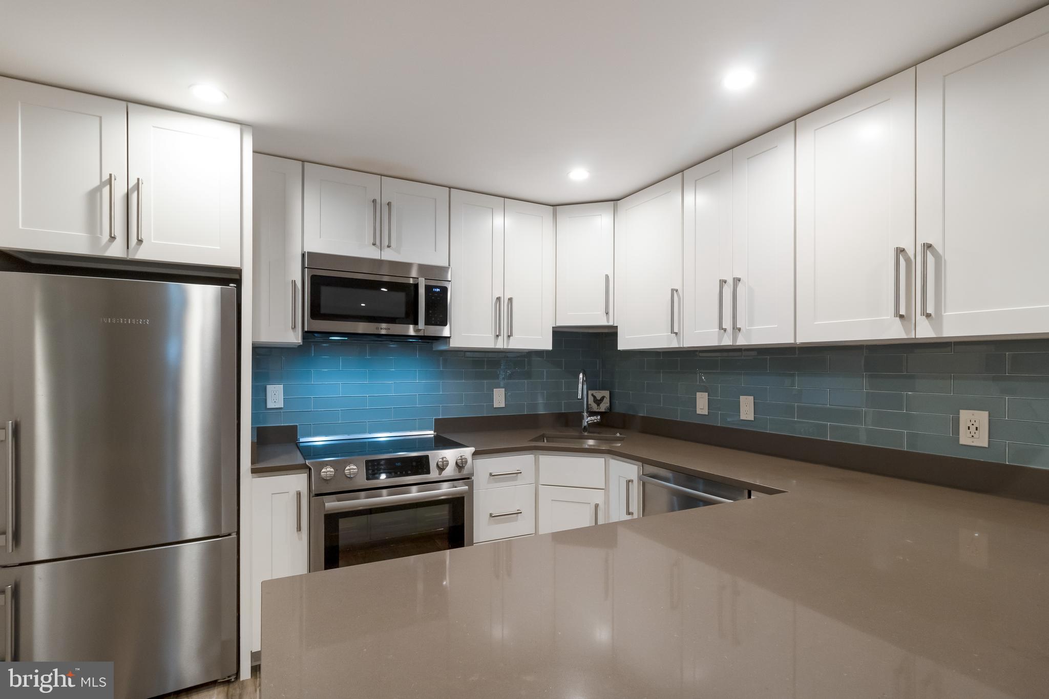 4514 15th Street Northwest, Unit B Washington, DC 20011 - Photo 20 of 34 a kitchen with granite countertop a refrigerator and a sink