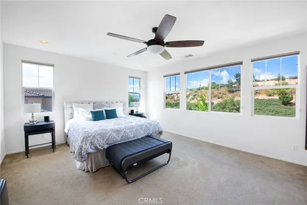 a view of walk in closet with white walls