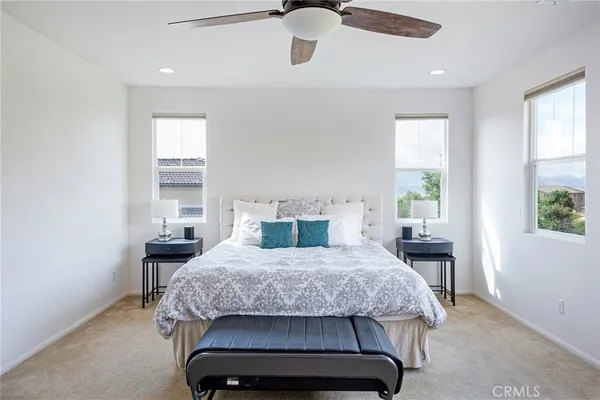 a spacious bathroom with a granite countertop sink and a mirror