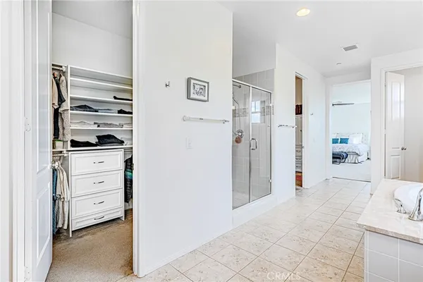 a living room with furniture a flat screen tv and a window
