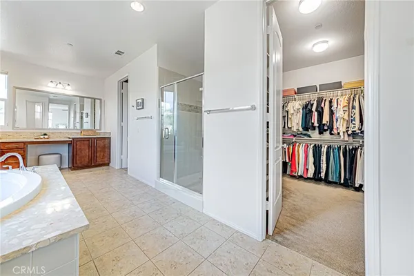 a room with a bed and a dresser