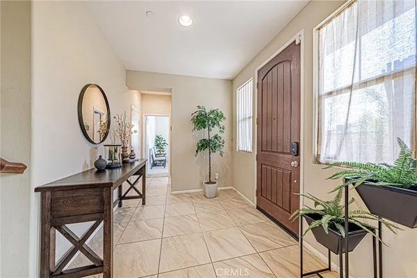 a view of a garden with a brick wall