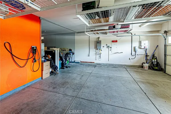 a front view of a house with a yard and flowers