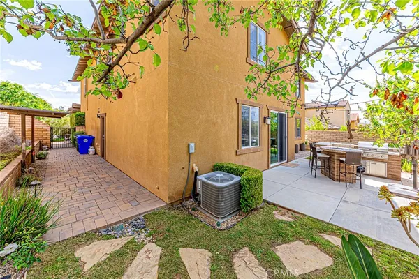 a view of a patio with chairs and plants