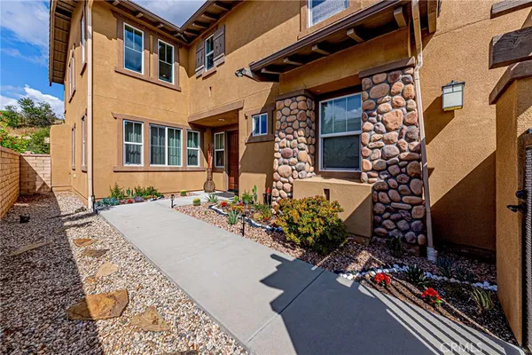 an aerial view of residential house with outdoor space and street view