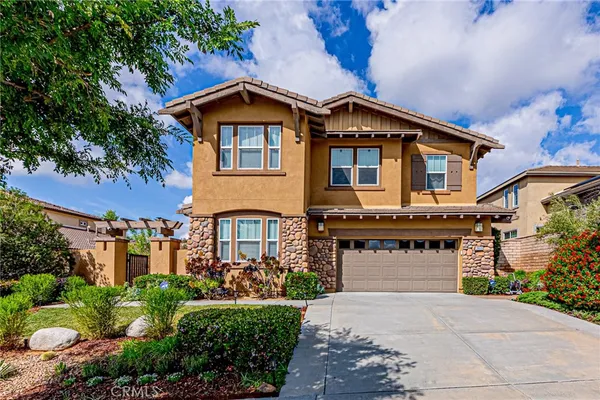 an aerial view of residential houses with outdoor space and parking