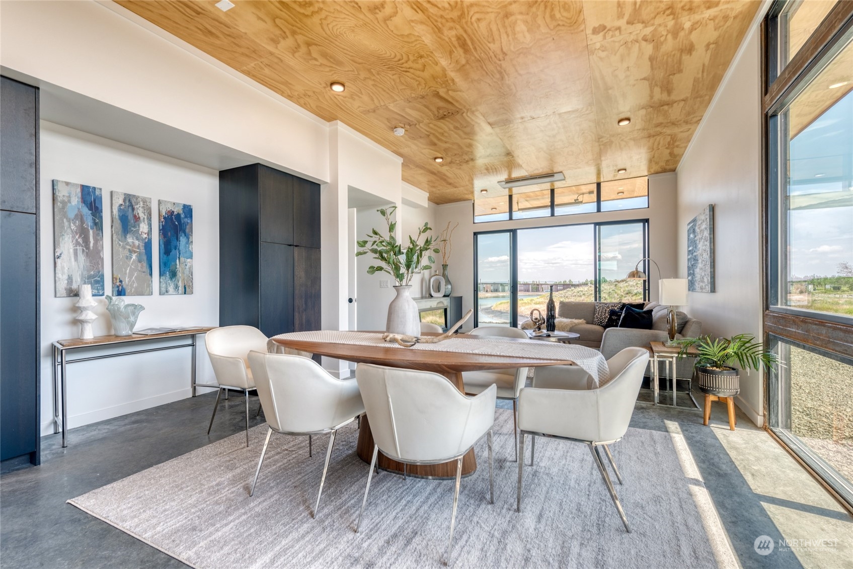 228 (lot 32) Nw Rattlesnake Point Road Quincy, WA 98848 - Photo 11 of 38 a view of a dining room with furniture wooden floor and a chandelier