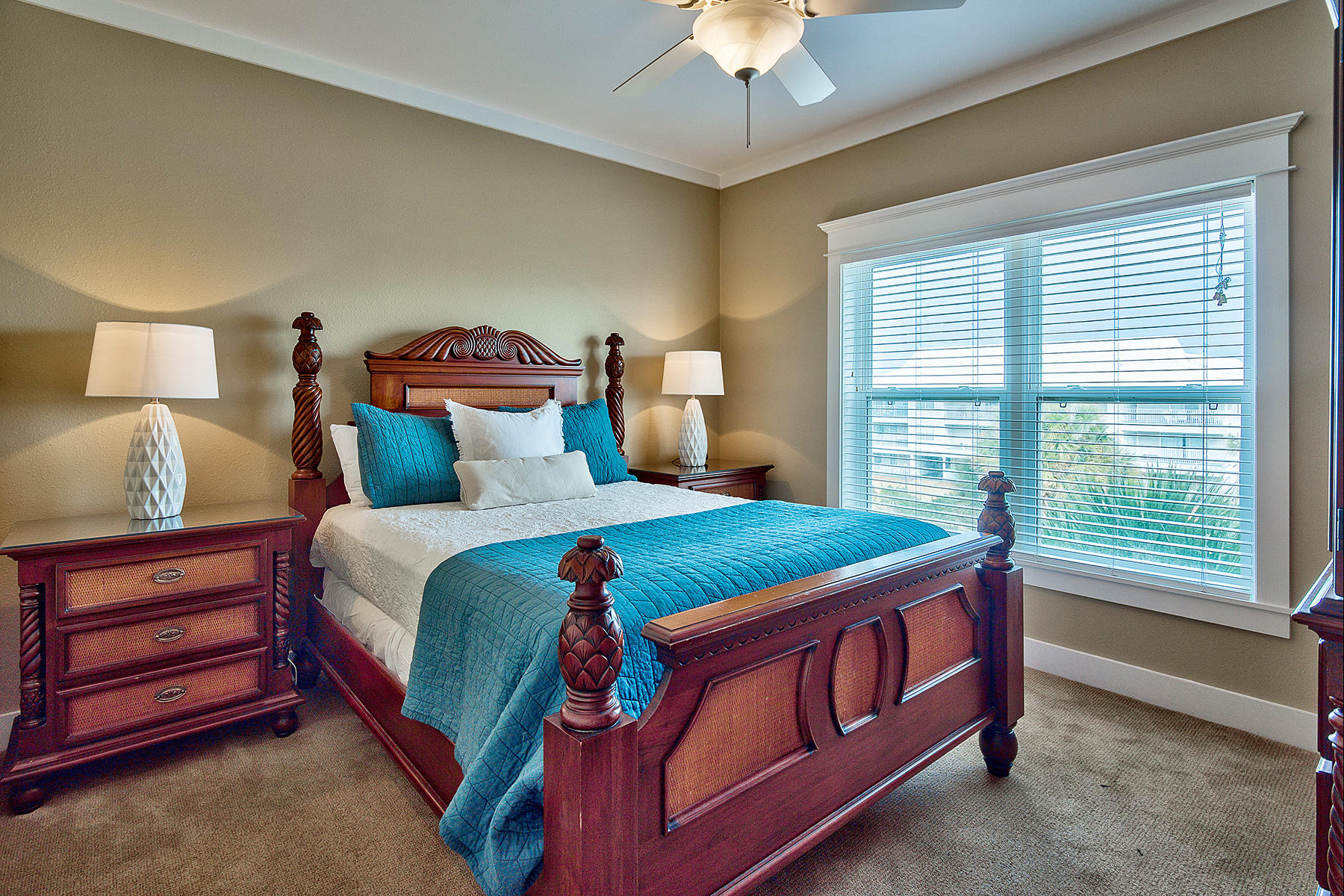 171 Chivas Lane Santa Rosa Beach, FL 32459 - Photo 12 of 32 a bedroom with a bed and a chandelier