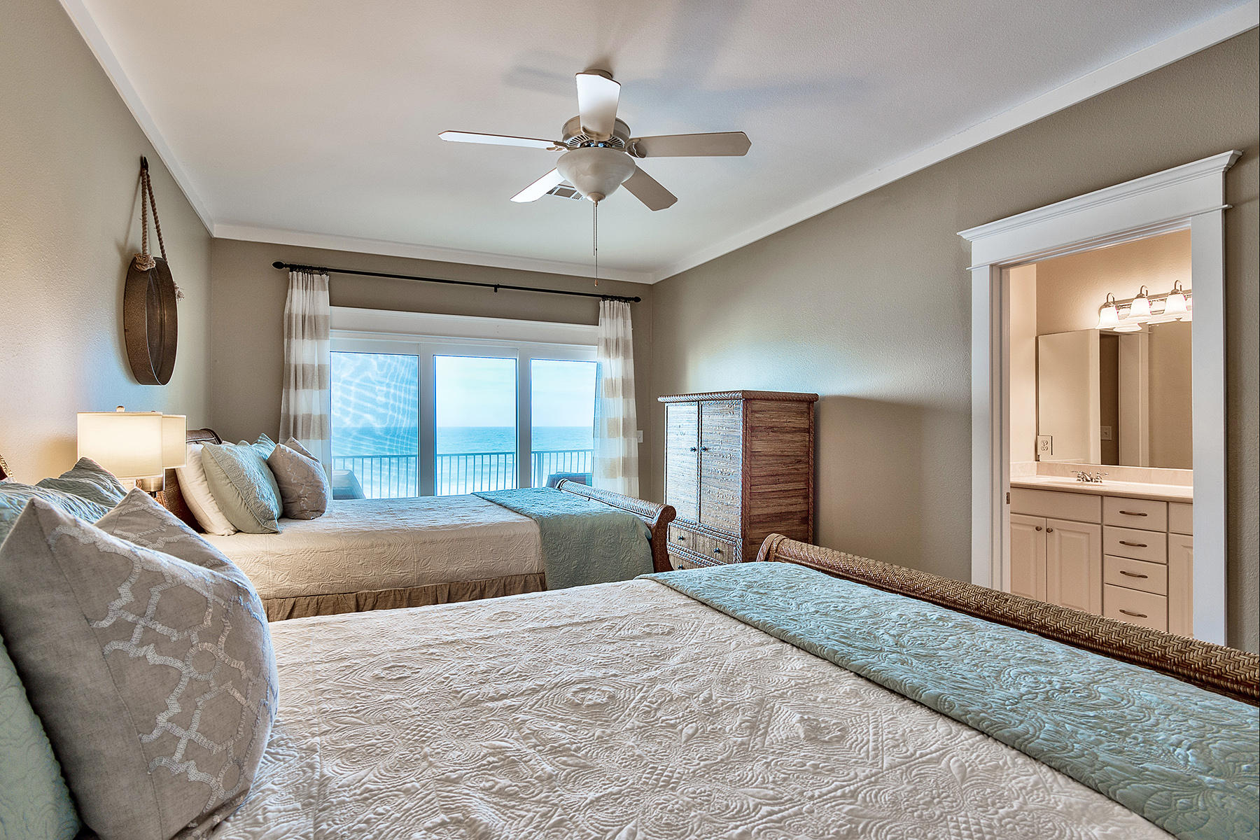 171 Chivas Lane Santa Rosa Beach, FL 32459 - Photo 15 of 32 a bedroom with a large bed and a chandelier
