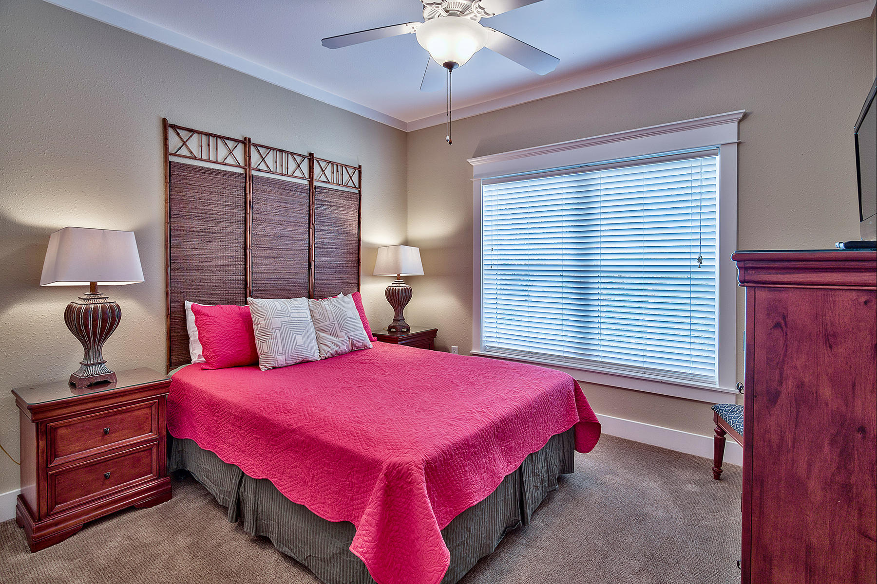 171 Chivas Lane Santa Rosa Beach, FL 32459 - Photo 26 of 32 a bedroom with a bed and a chandelier