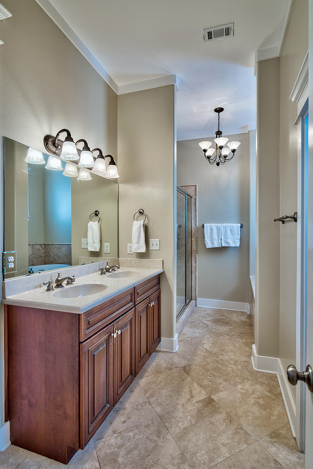 171 Chivas Lane Santa Rosa Beach, FL 32459 - Photo 10 of 32 a spacious bathroom with a granite countertop sink a mirror and a shower