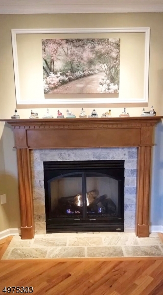 16 Main Street, Unit 1 Sparta, NJ 07871 - Photo 13 of 28 a view of fireplace with wooden floor