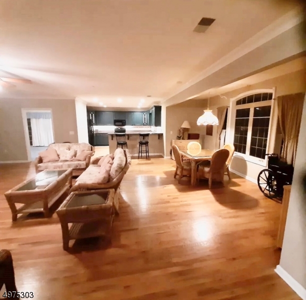 16 Main Street, Unit 1 Sparta, NJ 07871 - Photo 14 of 28 a living room with furniture large window and flat screen tv