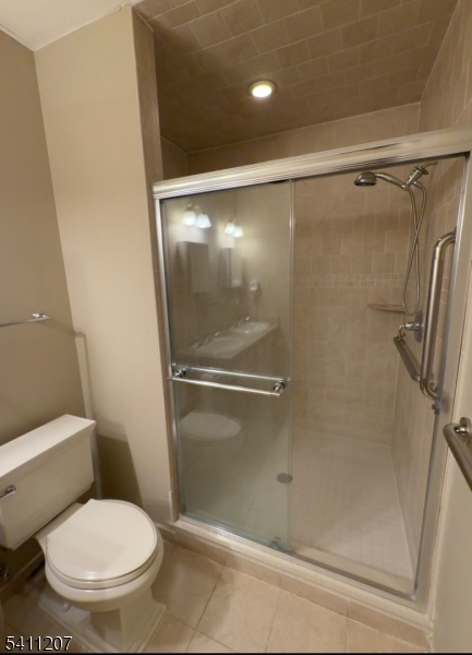 16 Main Street, Unit 1 Sparta, NJ 07871 - Photo 17 of 28 a white toilet sitting next to a shower