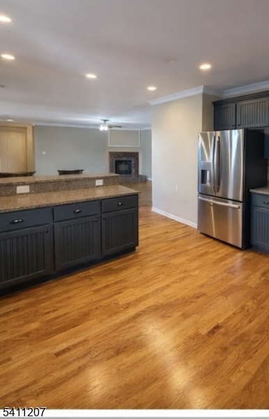16 Main Street, Unit 1 Sparta, NJ 07871 - Photo 21 of 28 a large kitchen with kitchen island a sink stainless steel appliances and cabinets
