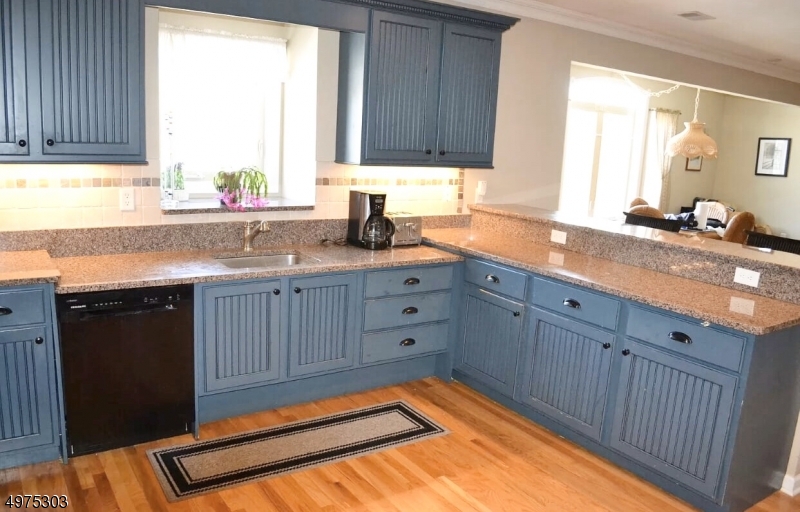 16 Main Street, Unit 1 Sparta, NJ 07871 - Photo 4 of 28 a kitchen with a sink window and cabinets