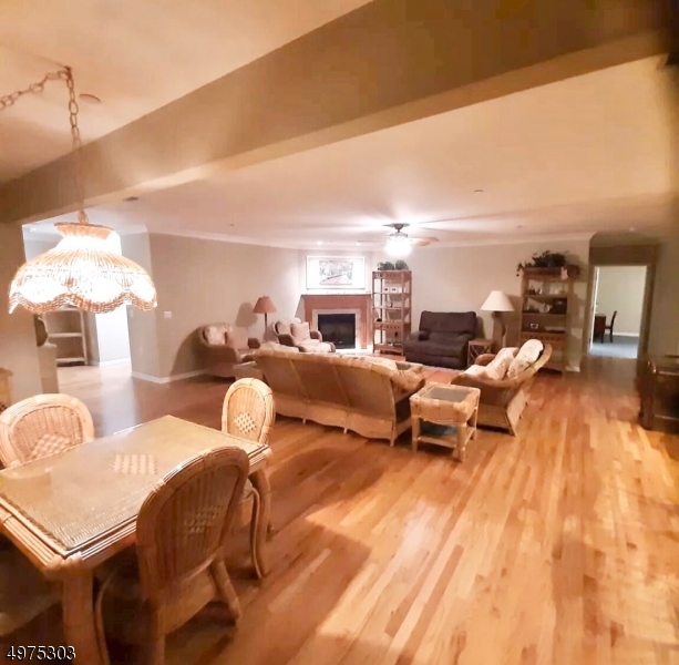 16 Main Street, Unit 1 Sparta, NJ 07871 - Photo 10 of 28 a living room with furniture and a chandelier
