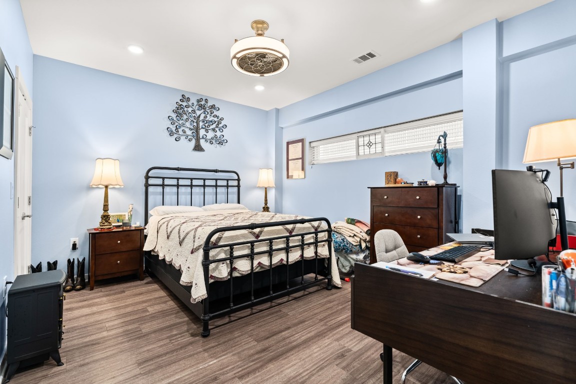 4361 South Congress Avenue, Unit 237 Austin, TX 78745 - Photo 11 of 28 a bedroom with a bed and a desk